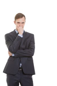 gestures distrust lies. body language. a man in a business suit isolated on white background